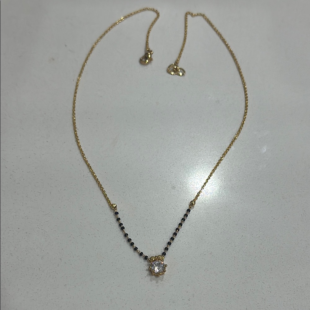 Elegant Gold and Black Necklace